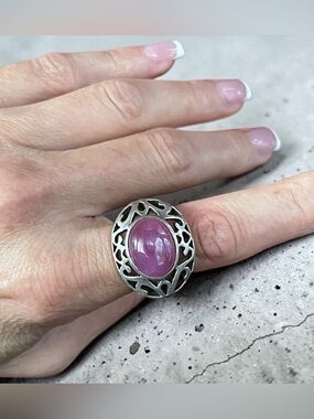 large dome shaped oval ruby cabochon bezel set in thick ornate sterling